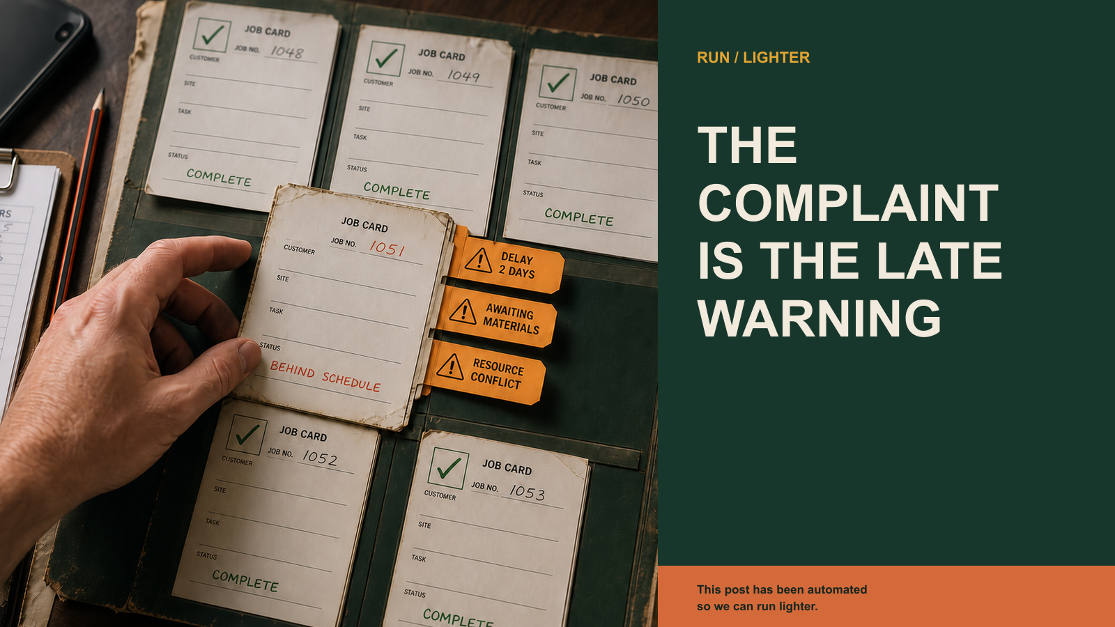 A hand selects a business job card marked behind schedule, with amber tabs showing a delay, missing materials and a resource conflict.